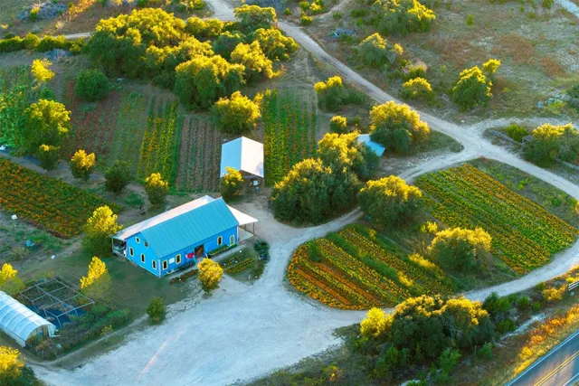 a view of a house with swimming pool and porch