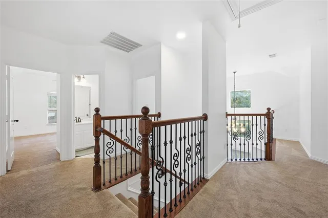 a view of a hallway with windows