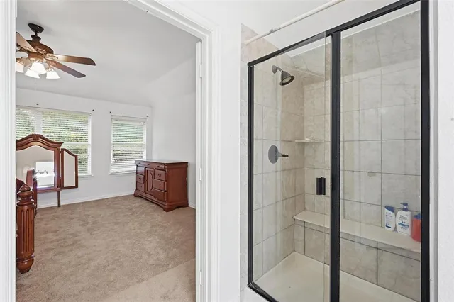 a bedroom with a bed chair and a desk