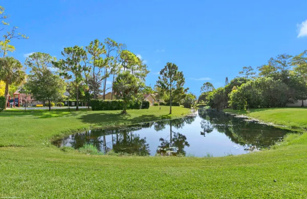 a view of a golf course with a lake