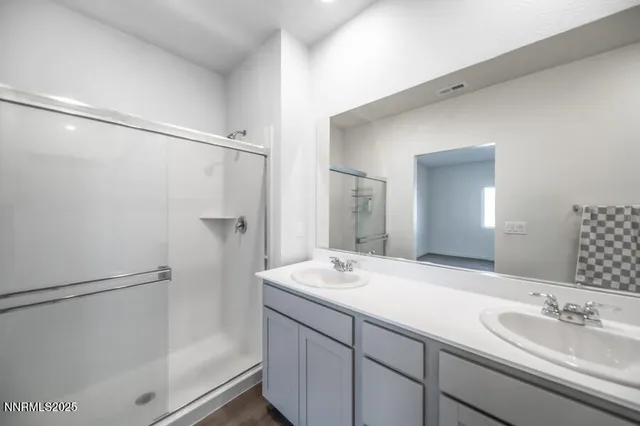 a bedroom with bed and window