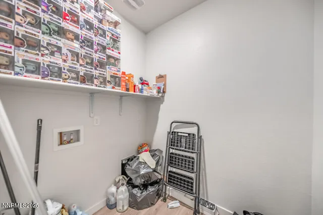 a view of a house with wooden fence