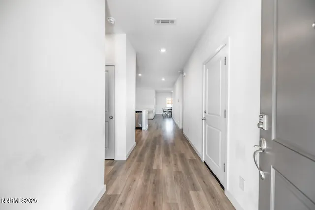 a kitchen with a sink a counter top stainless steel appliances and cabinets