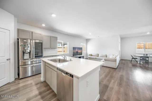 a kitchen with a stove a sink and a refrigerator