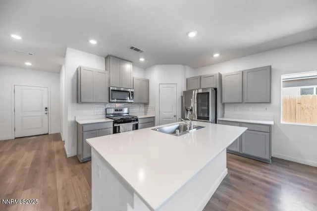 a kitchen with a stove and a microwave