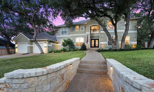 a front view of house with yard and green space