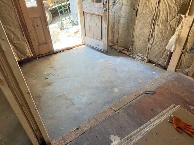 a view of a room with wooden walls