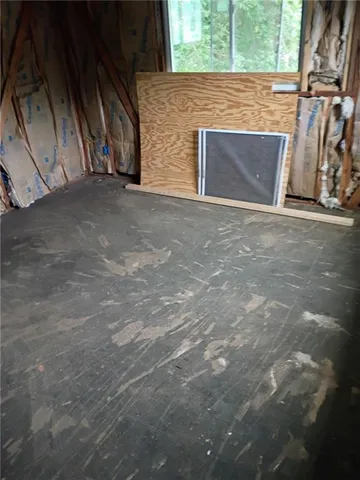 a view of an empty room with windows