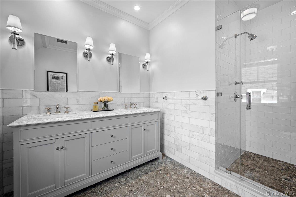 23 Fairlawn Street Rye, NY 10580 - Photo 20 of 38 Ensuite primary bathroom with double sink vanity and spa walk in shower.