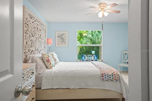 a bathroom with a sink mirror vanity and toilet