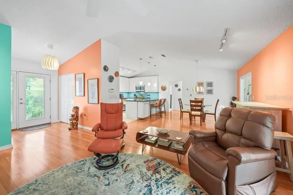 a view of a dining room with furniture window and wooden floor