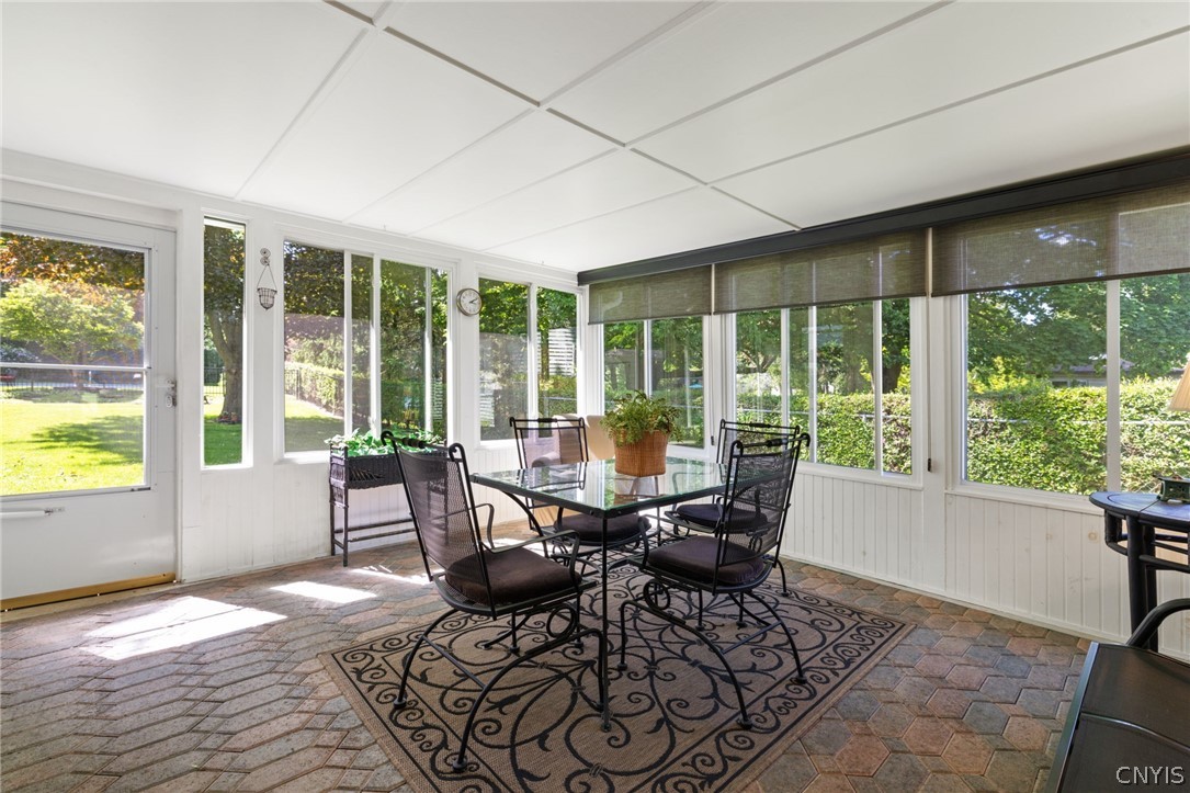 410 Meadow Road Geddes, NY 13219 - Photo 38 of 50 Three season sun room off of the garage, your soon to be peaceful retreat.