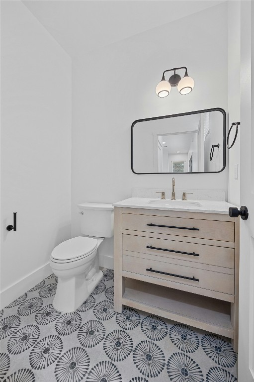 4704 Enchanted Lane, Unit B Austin, TX 78745 - Photo 11 of 23 a bathroom with a toilet and a mirror