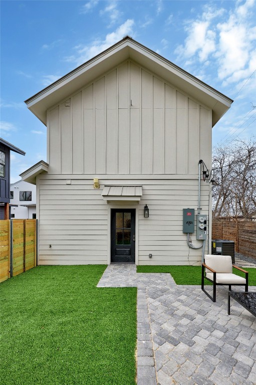 4704 Enchanted Lane, Unit B Austin, TX 78745 - Photo 19 of 23 a view of a backyard with a barbeque grill and a small yard
