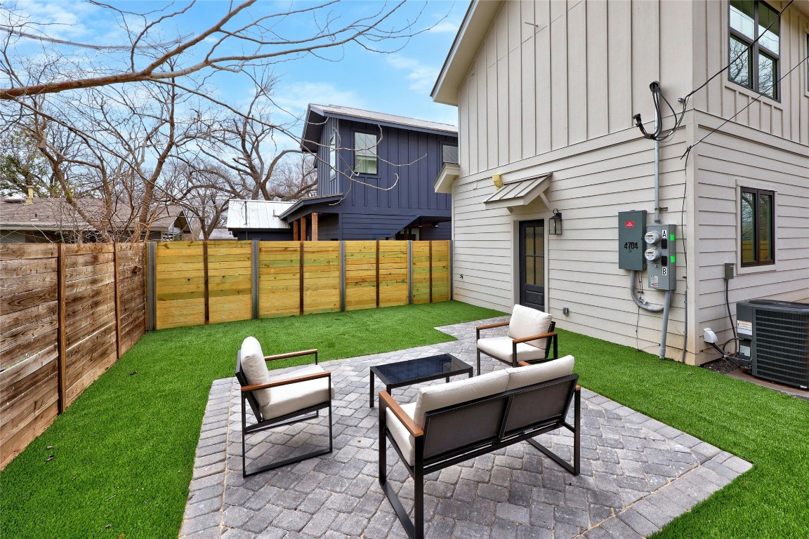 4704 Enchanted Lane, Unit B Austin, TX 78745 - Photo 22 of 23 a view of a patio with a yard