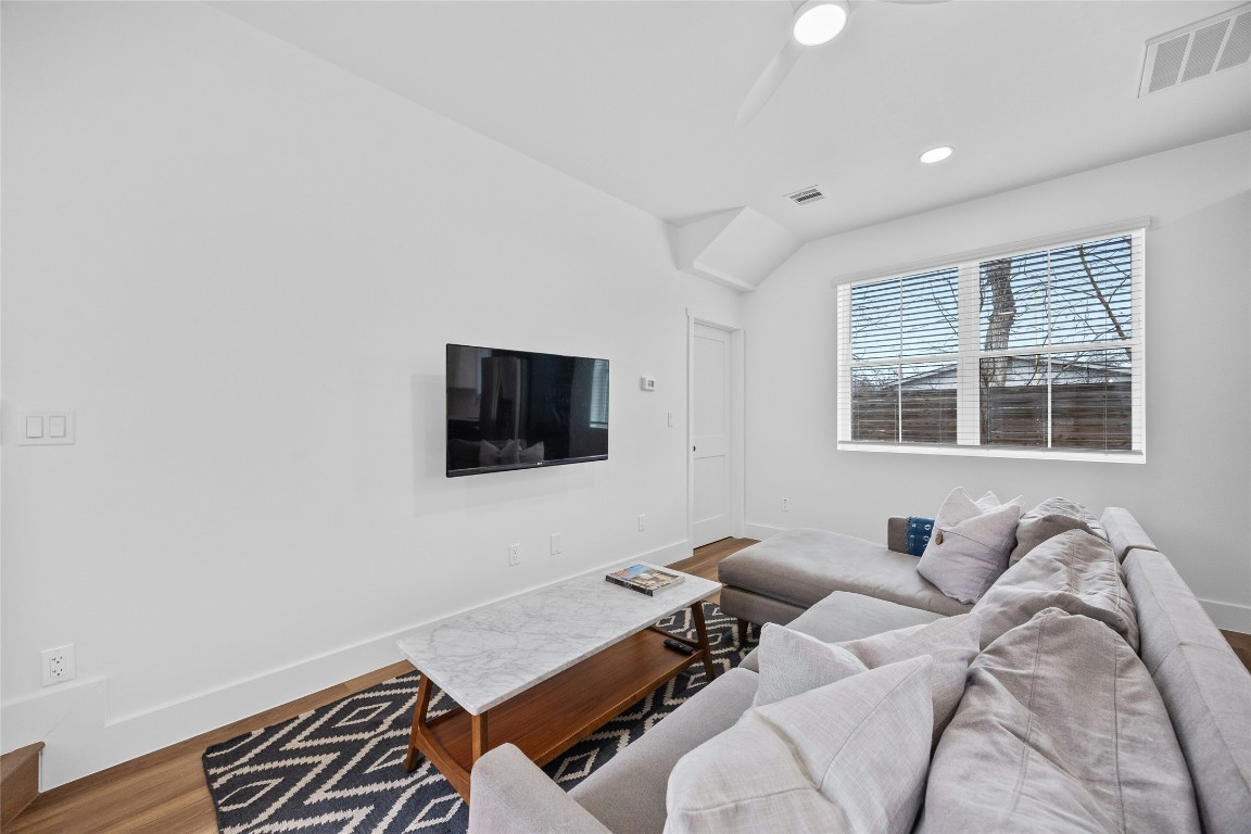 4704 Enchanted Lane, Unit B Austin, TX 78745 - Photo 5 of 23 a living room with furniture and a flat screen tv