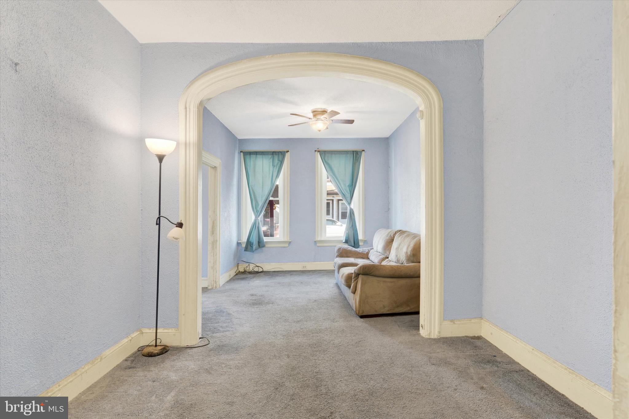 306 South 9th Street Lebanon, PA 17042 - Photo 15 of 42 a living room with a couch and a chandelier