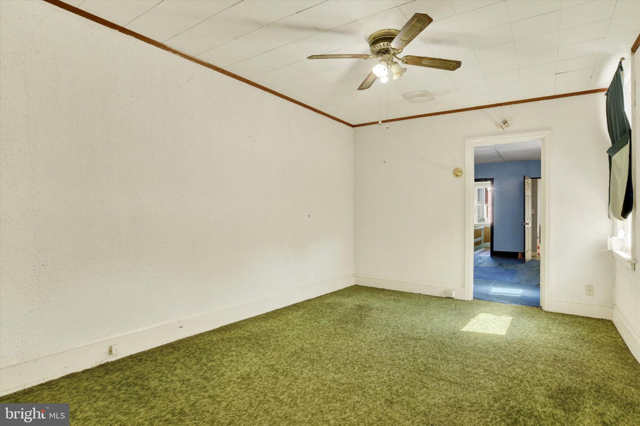 306 South 9th Street Lebanon, PA 17042 - Photo 36 of 42 a view of a big room with a ceiling fan and a chandelier fan