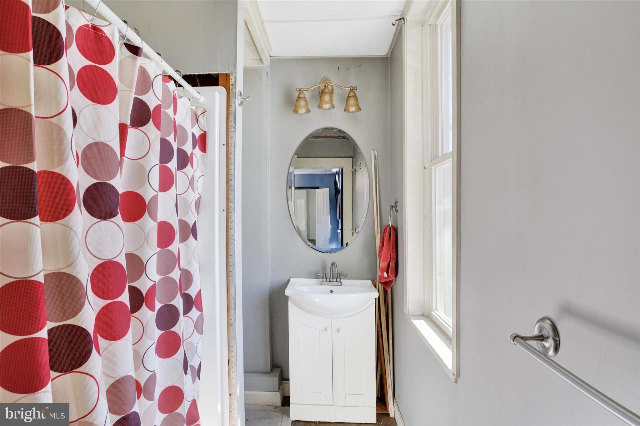 306 South 9th Street Lebanon, PA 17042 - Photo 40 of 42 a bathroom with a sink toilet and mirror