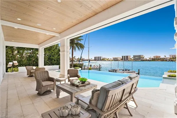a view of an chairs and table in patio
