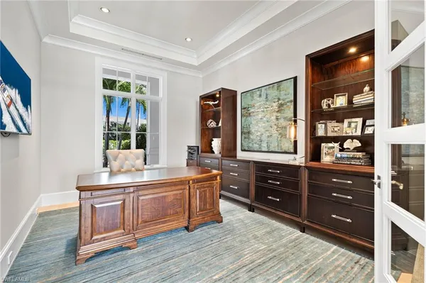 a room with a dresser and a window