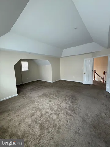 a kitchen with a stove and a refrigerator