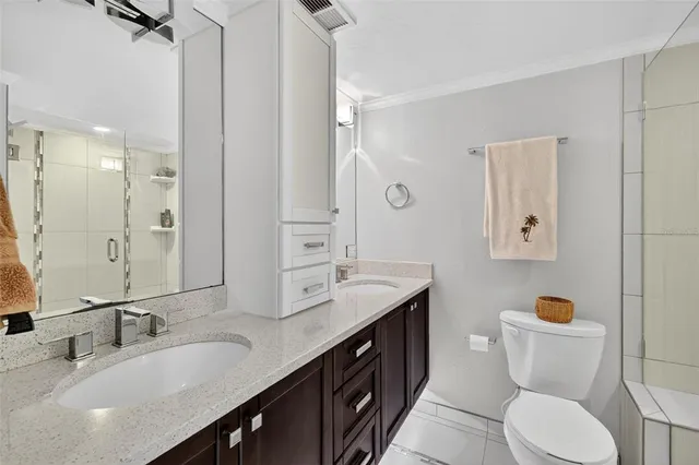 a bedroom with beds and a window