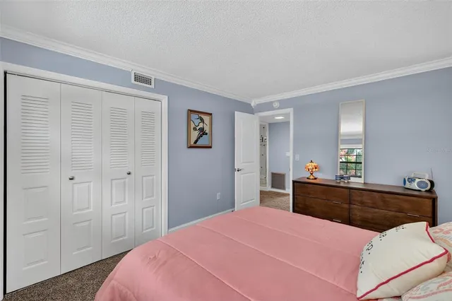 a car parked in front of a white building