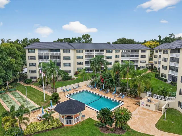 a view of a house with backyard space and patio