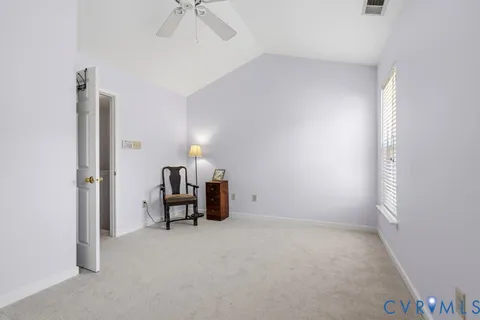 a view of room with furniture and a window