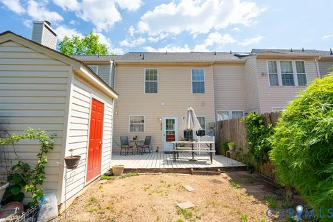 a house view with a outdoor seating