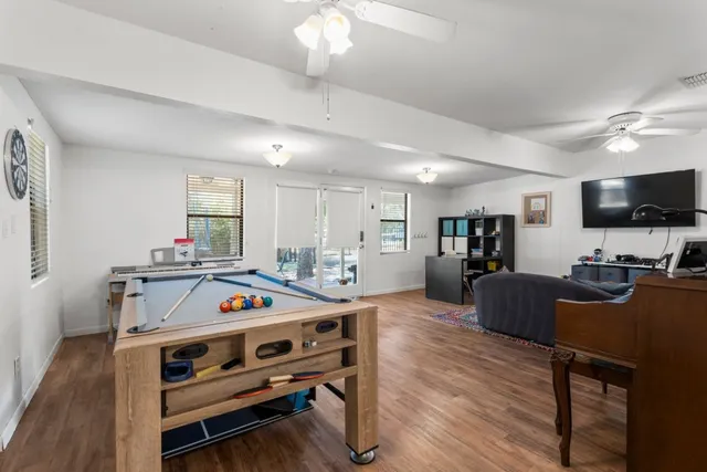 a view of kitchen with furniture and wooden floor