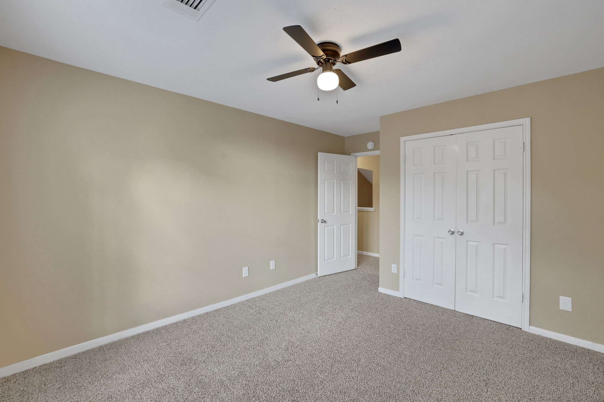 23207 Olive Ridge Court Katy, TX 77494 - Photo 31 of 46 an empty room with ceiling fan and window
