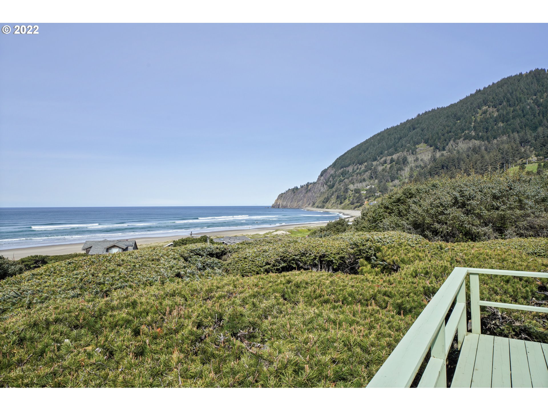 8125 Neahkahnie Road Nehalem, OR 97131 - Photo 14 of 32 a view of a yard with a wooden fence