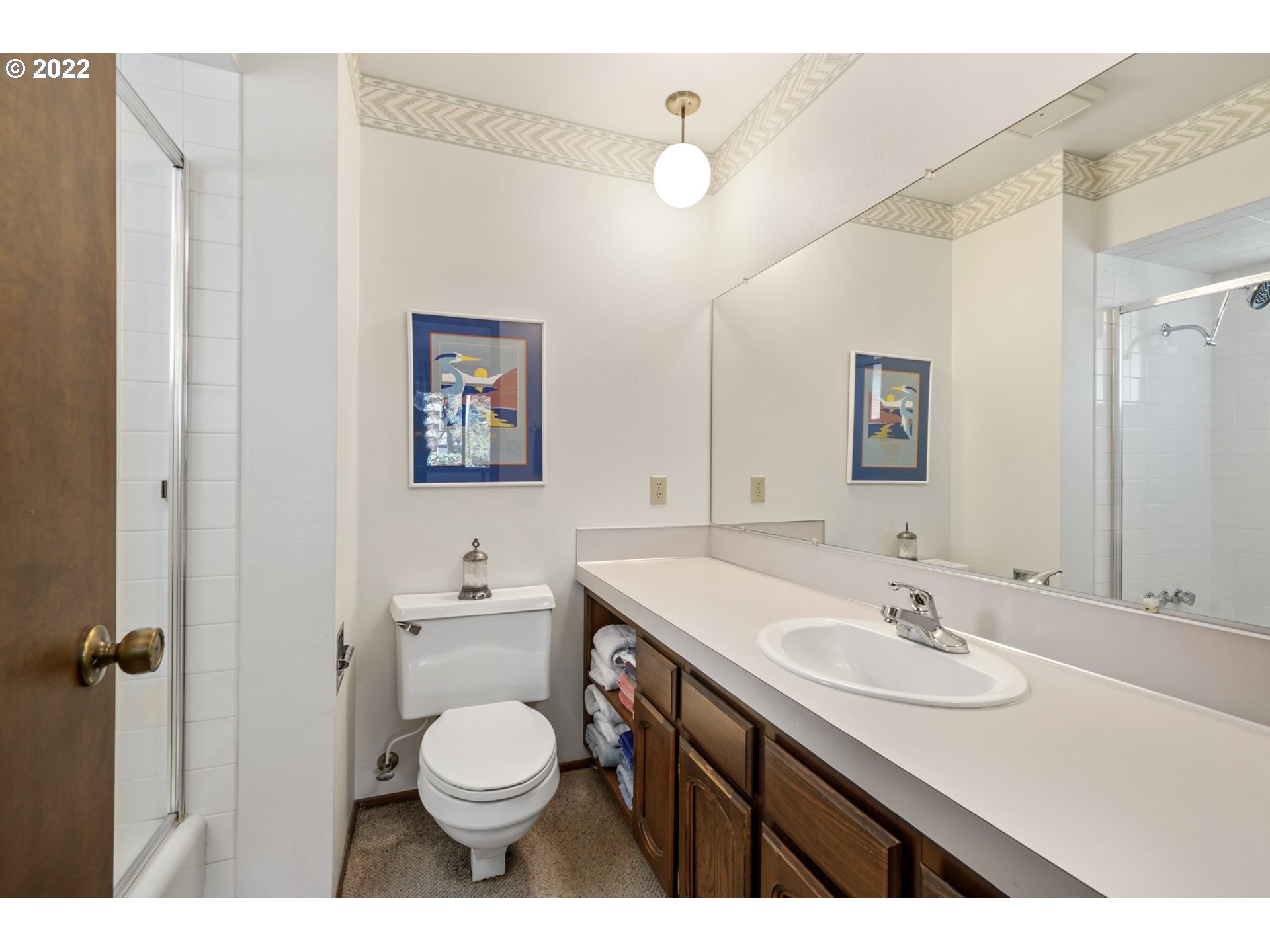 8125 Neahkahnie Road Nehalem, OR 97131 - Photo 20 of 32 a bathroom with a sink a toilet and mirror
