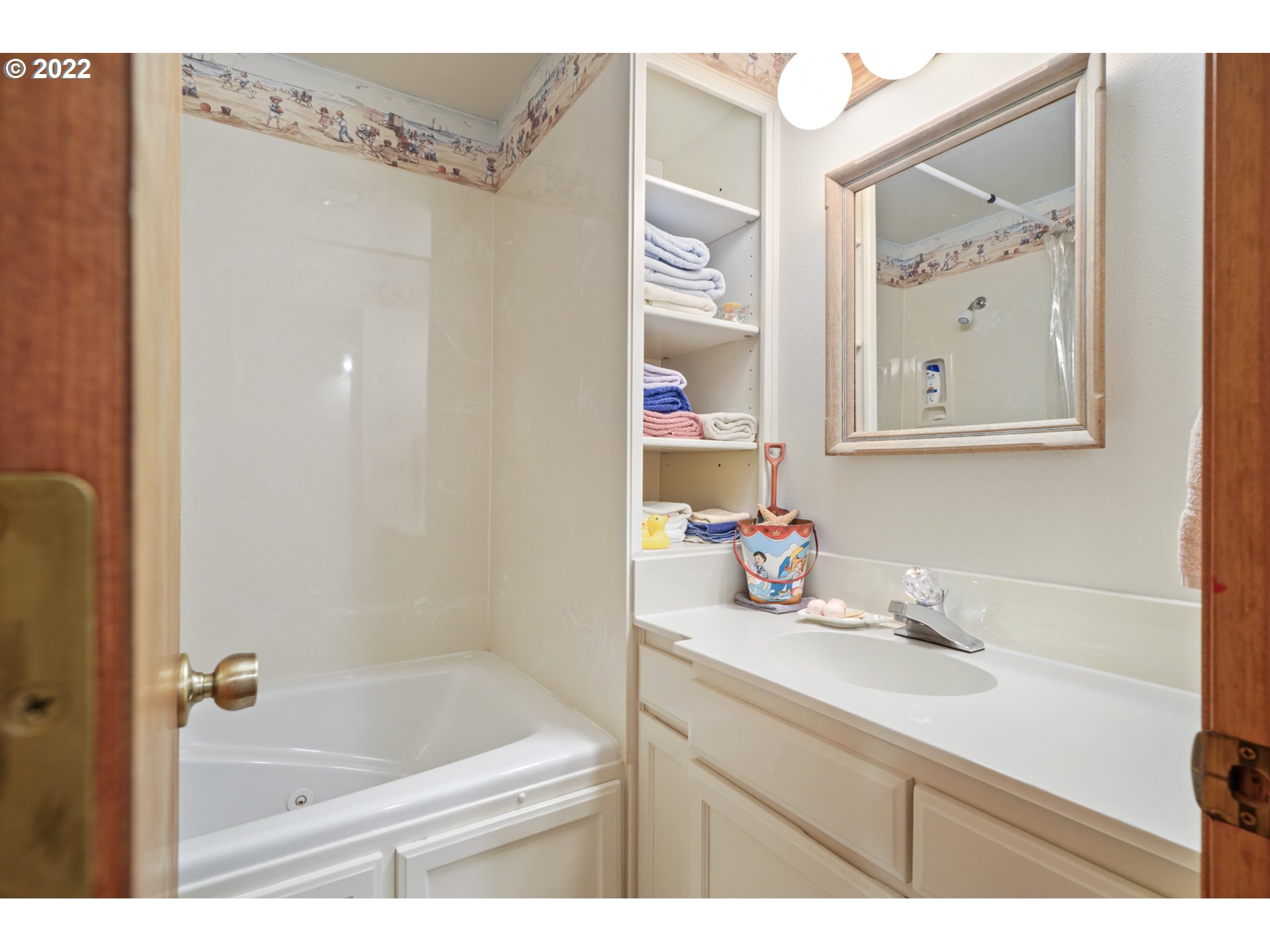8125 Neahkahnie Road Nehalem, OR 97131 - Photo 29 of 32 a bathroom with a sink vanity tub and shower