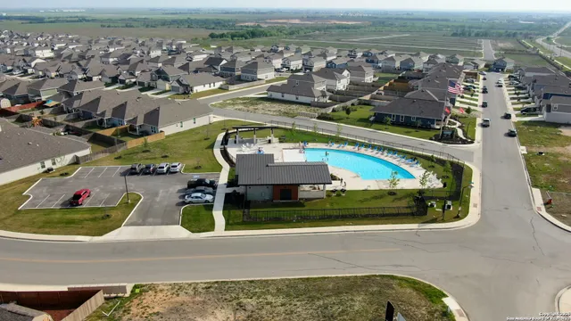 an aerial view of a house with a ocean view