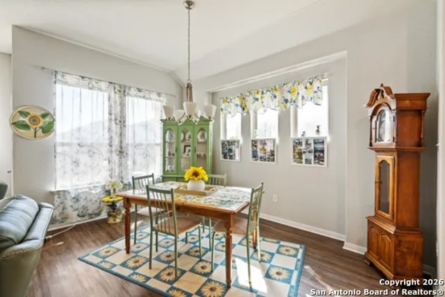 a view of a dining room with furniture window and outside view