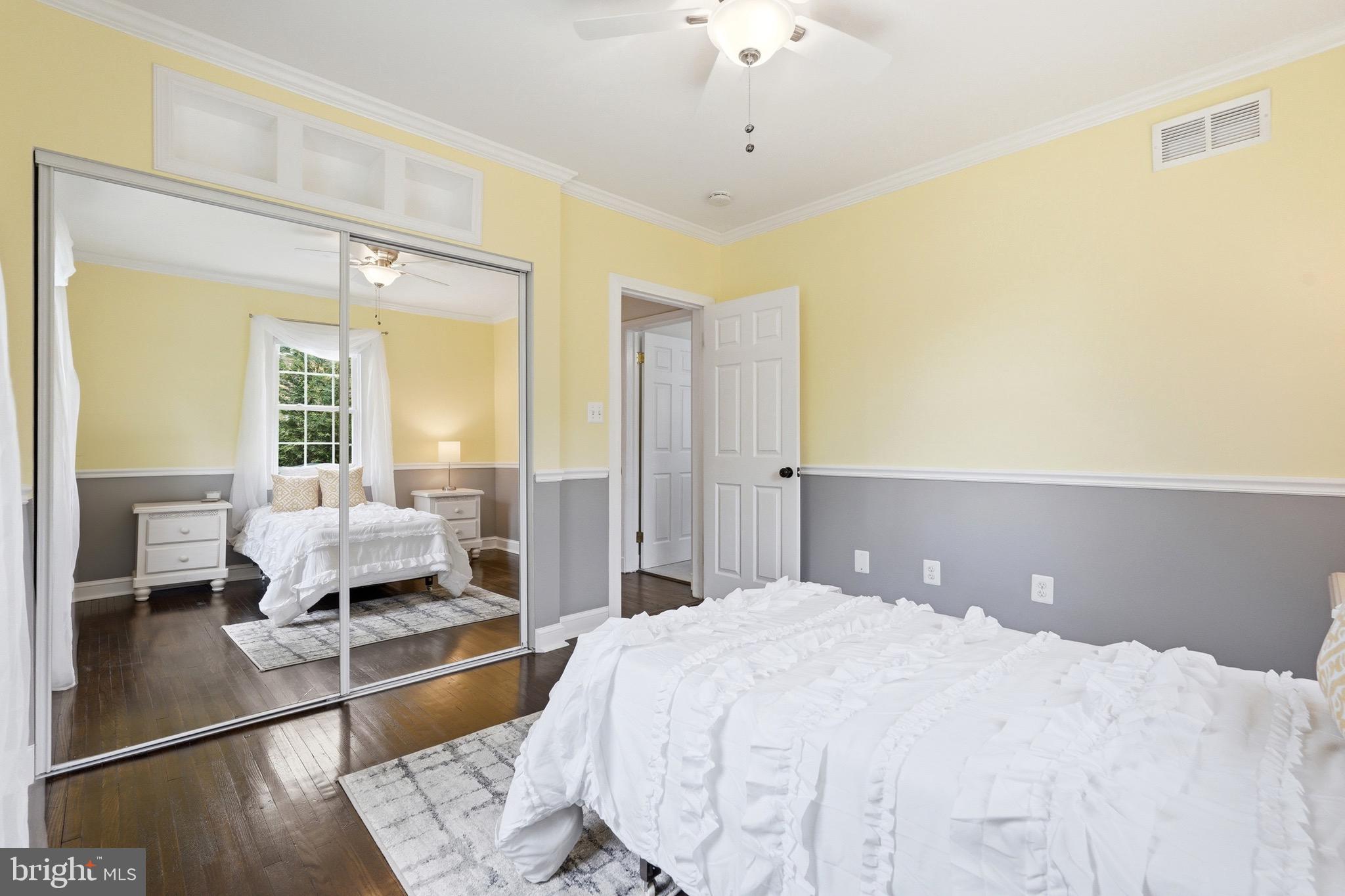 23725 Woodfield Road Gaithersburg, MD 20882 - Photo 20 of 61 a spacious bedroom with a bed and wooden floor