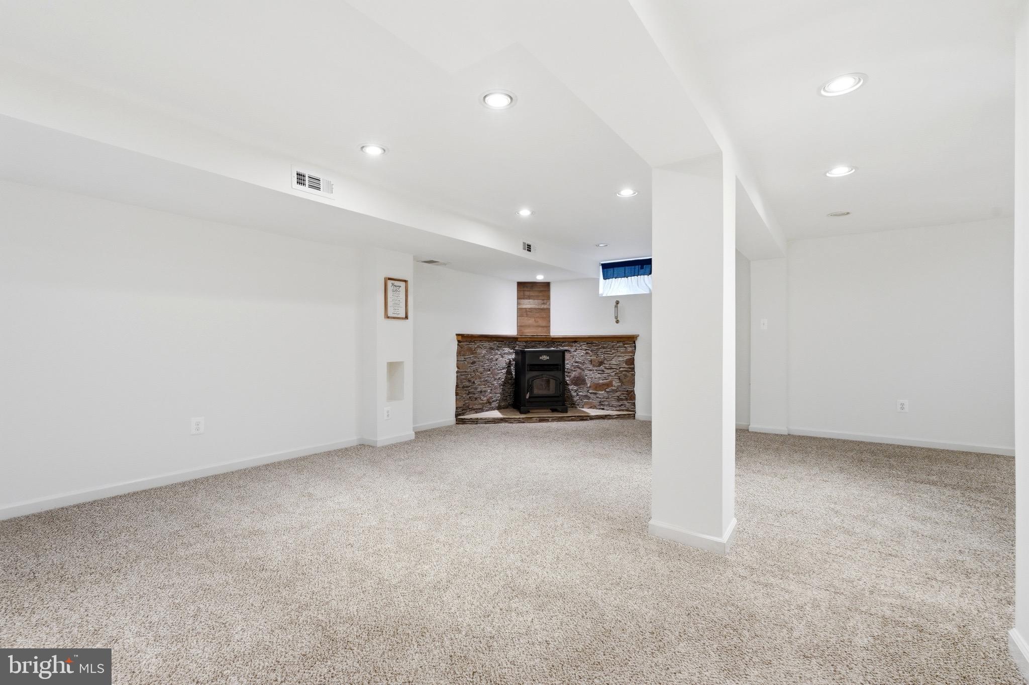 23725 Woodfield Road Gaithersburg, MD 20882 - Photo 25 of 61 an empty room with furniture and a kitchen