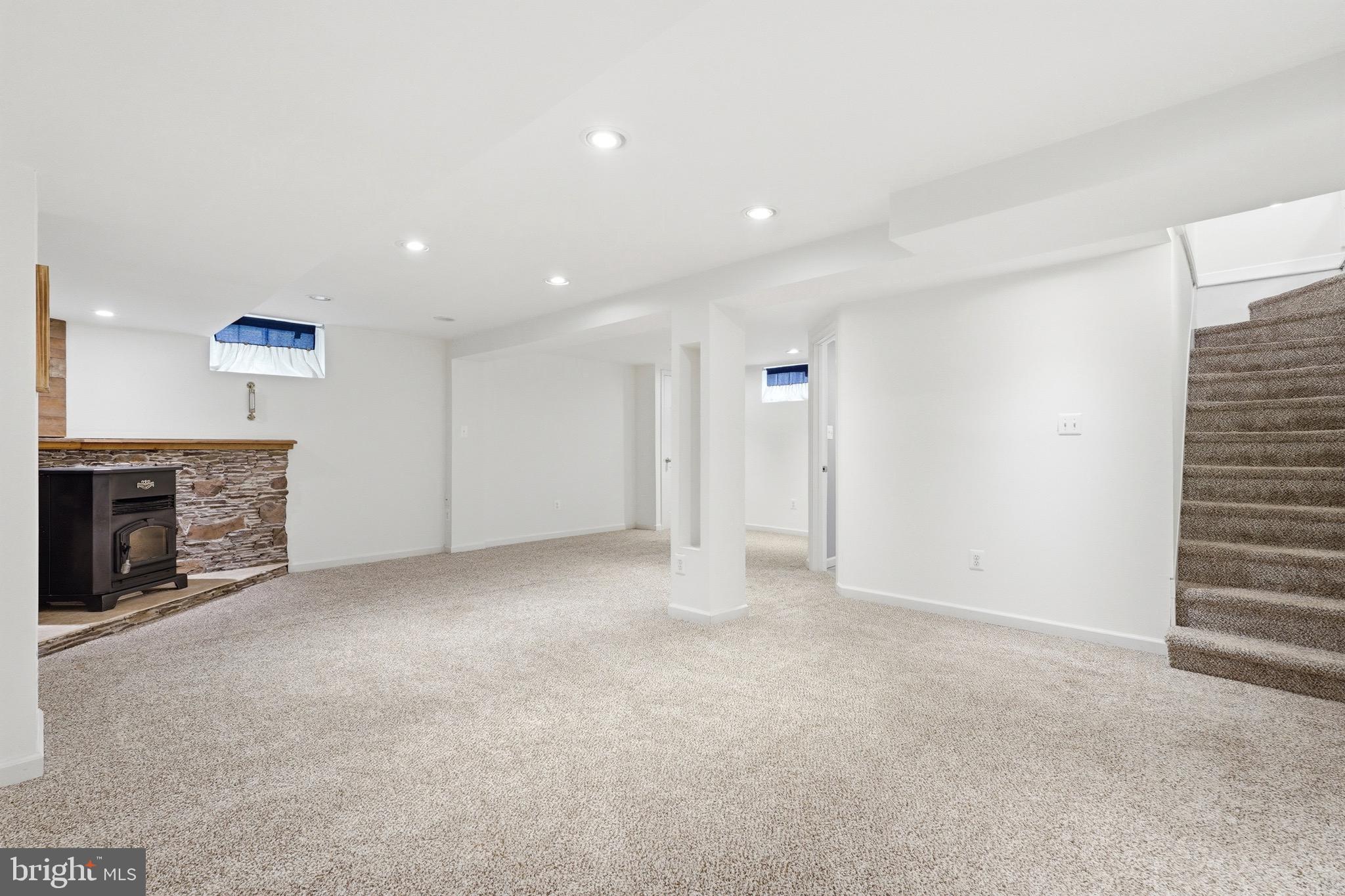 23725 Woodfield Road Gaithersburg, MD 20882 - Photo 27 of 61 a view of an empty room with a fireplace