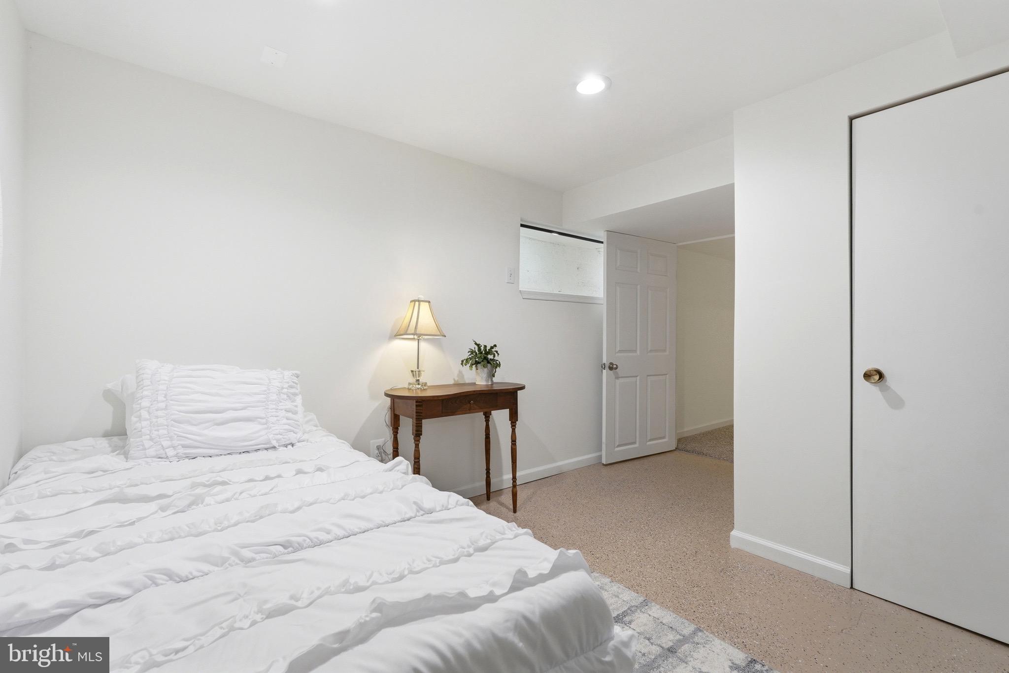 23725 Woodfield Road Gaithersburg, MD 20882 - Photo 31 of 61 a bedroom with a bed and a table