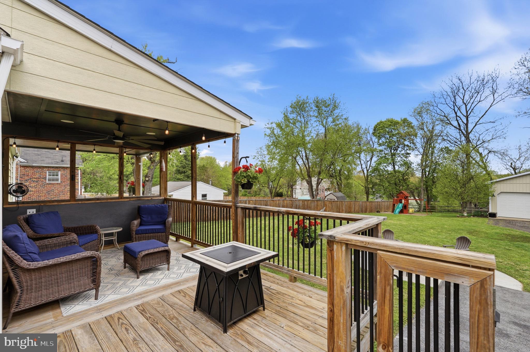 23725 Woodfield Road Gaithersburg, MD 20882 - Photo 35 of 61 a view of house with outdoor seating and green space
