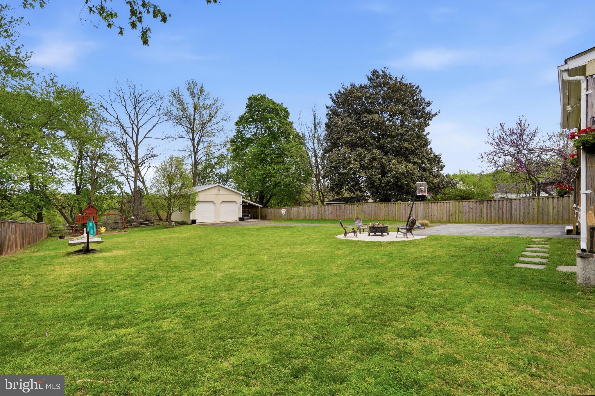 23725 Woodfield Road Gaithersburg, MD 20882 - Photo 38 of 61 a front view of a house with a yard