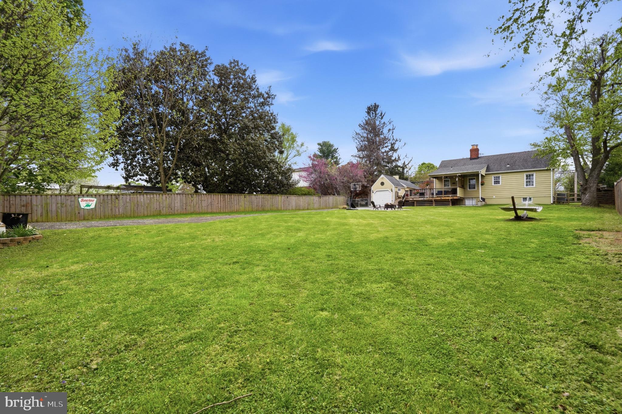23725 Woodfield Road Gaithersburg, MD 20882 - Photo 39 of 61 a view of a field of grass and trees