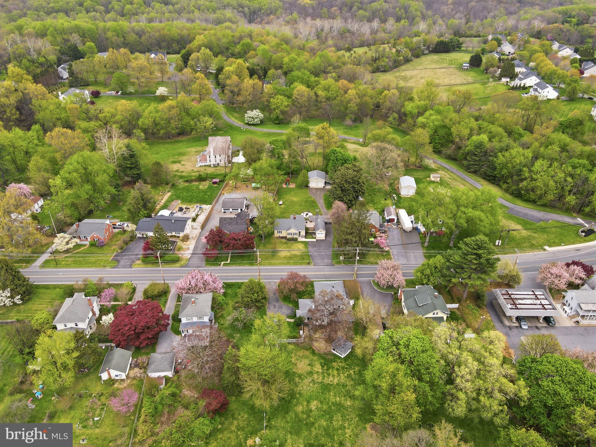 23725 Woodfield Road Gaithersburg, MD 20882 - Photo 49 of 61 an aerial view of residential houses with outdoor space and street view