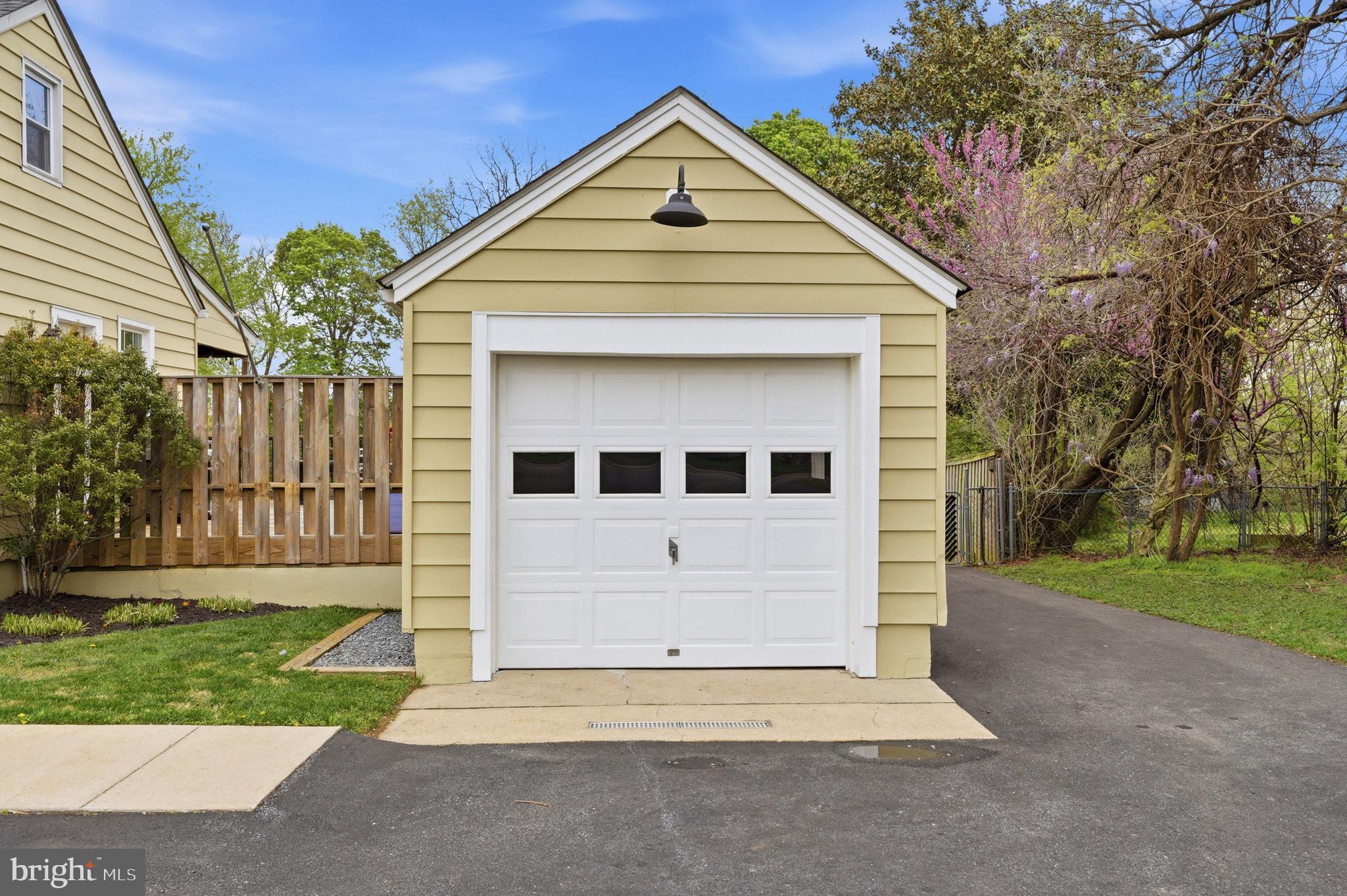 23725 Woodfield Road Gaithersburg, MD 20882 - Photo 5 of 61 a front view of a house with a yard