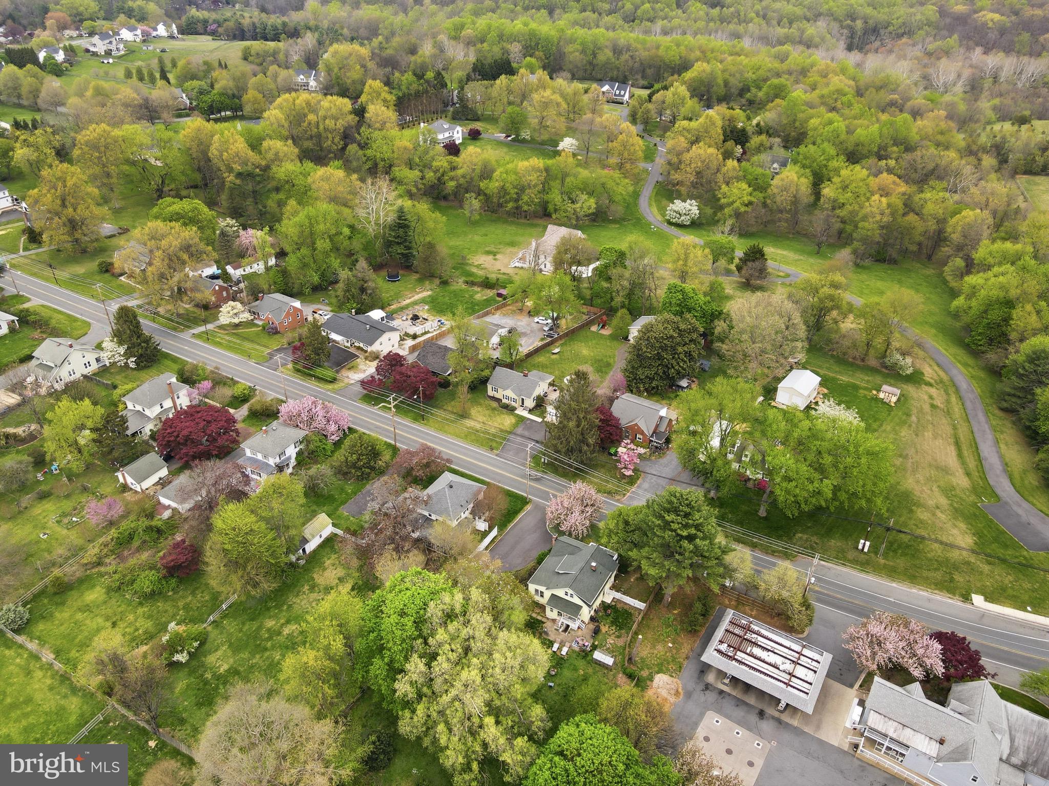 23725 Woodfield Road Gaithersburg, MD 20882 - Photo 51 of 61 an aerial view of a residential houses with yard