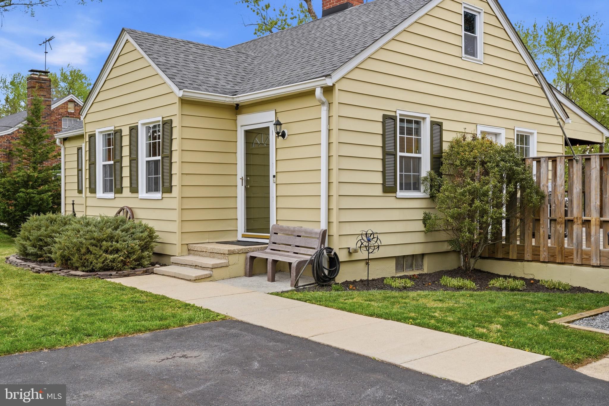 23725 Woodfield Road Gaithersburg, MD 20882 - Photo 6 of 61 a front view of a house with a yard