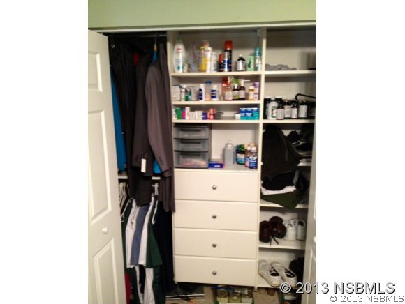 3224 Mango Tree Drive Edgewater, FL 32141 - Photo 11 of 17 a view of walk in closet with clothes and shoes